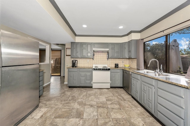 kitchen featuring gray cabinets, sink, stainless steel appliances, and tasteful backsplash