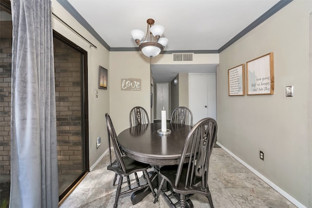 dining space with an inviting chandelier and ornamental molding