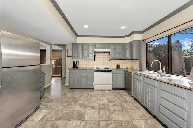 kitchen featuring backsplash, stainless steel appliances, extractor fan, sink, and gray cabinets