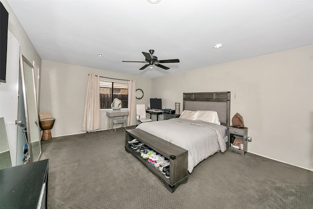 bedroom featuring dark colored carpet and ceiling fan