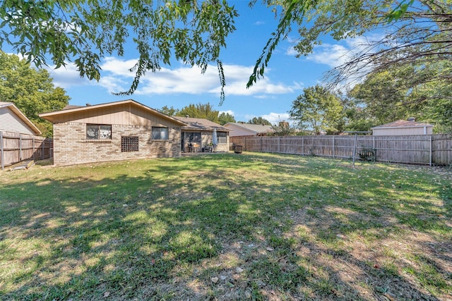 view of yard featuring a fenced backyard