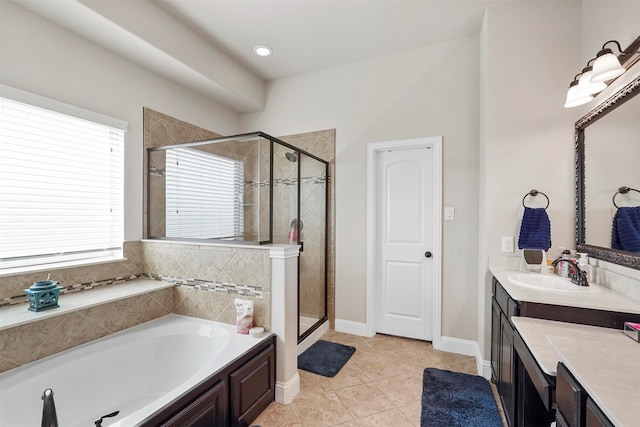 bathroom featuring vanity, shower with separate bathtub, and tile patterned flooring