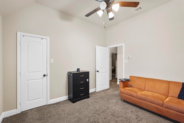 carpeted living room with high vaulted ceiling and ceiling fan