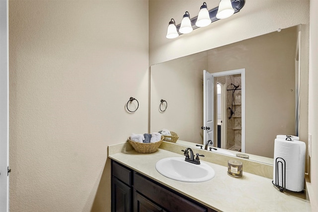 bathroom with vanity and walk in shower