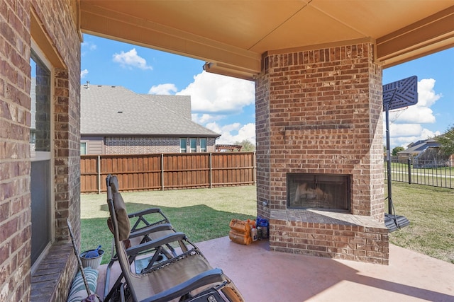 view of patio featuring an outdoor brick fireplace