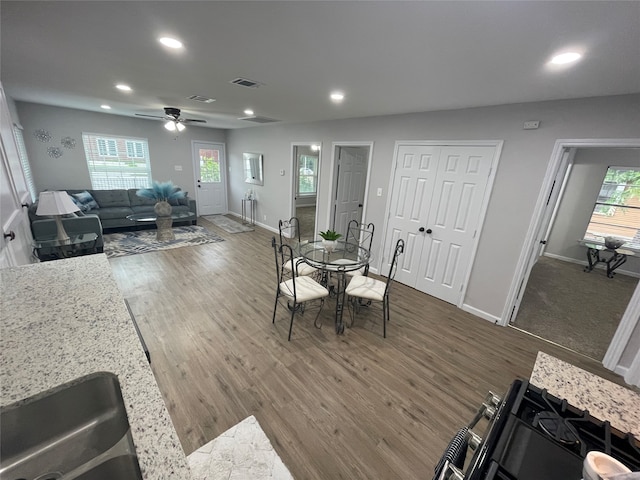 dining room featuring ceiling fan and dark hardwood / wood-style floors