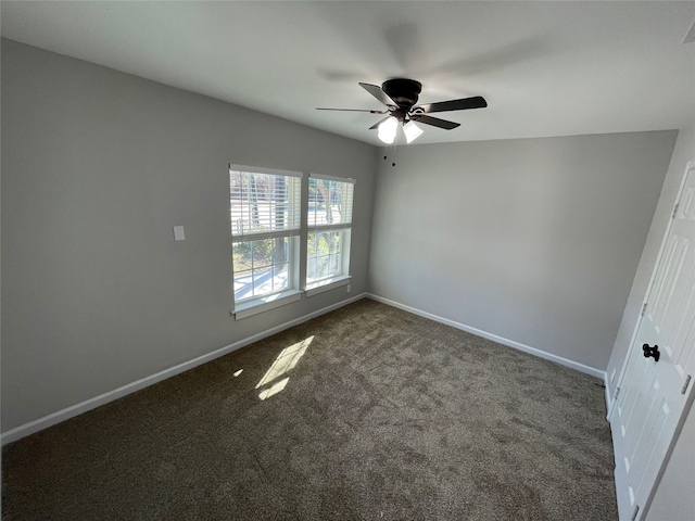 carpeted empty room featuring ceiling fan