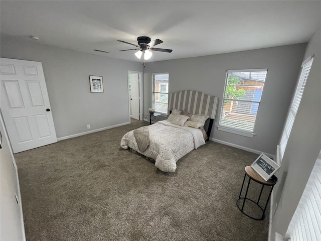 bedroom with dark carpet and ceiling fan