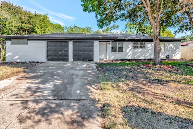 ranch-style house featuring a garage