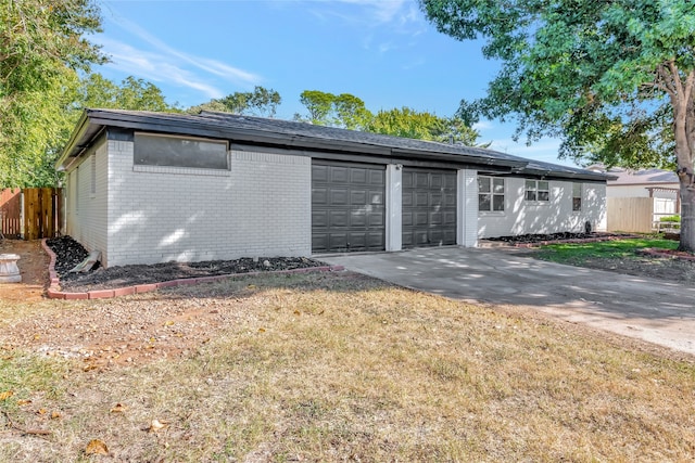 exterior space with a front yard, an outdoor structure, and a garage