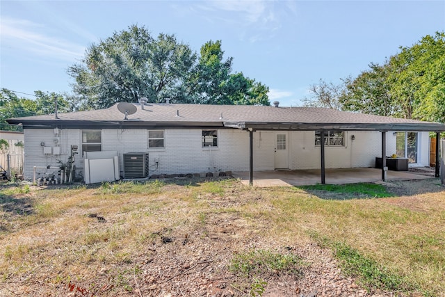 back of house featuring cooling unit, a yard, and a patio area