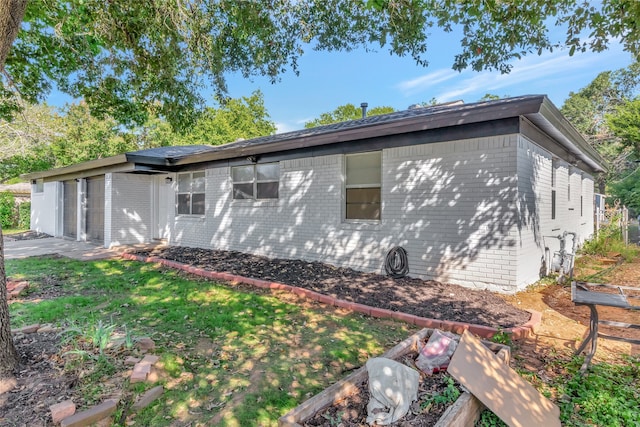 view of side of property with a garage