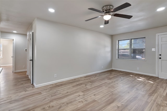 unfurnished room with light wood-type flooring and ceiling fan