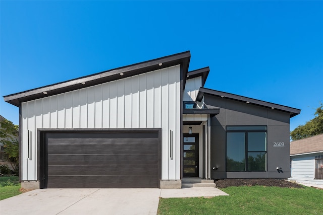 modern home with a garage and a front yard