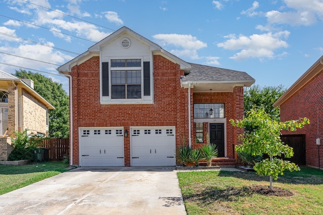 view of front of home with a garage and a front lawn