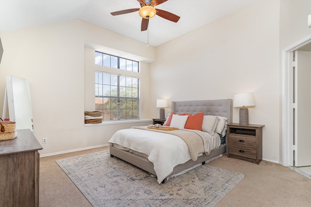 carpeted bedroom featuring lofted ceiling and ceiling fan