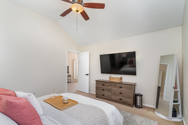 bedroom featuring ceiling fan, light colored carpet, and lofted ceiling