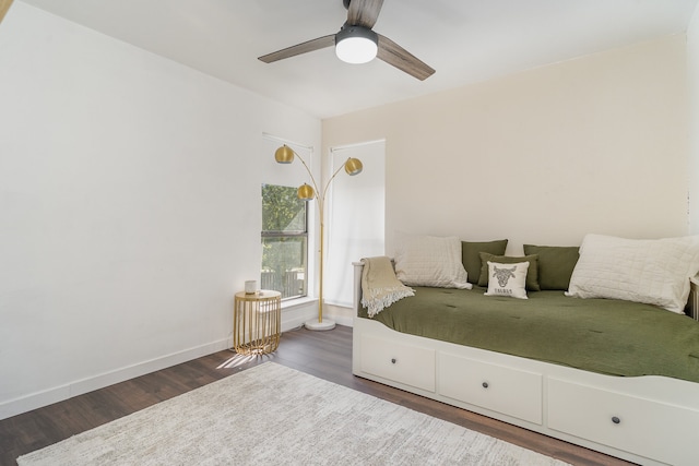 bedroom with ceiling fan and dark wood-type flooring