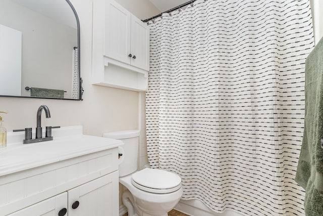 full bathroom with shower / bath combination with curtain, vanity, and toilet