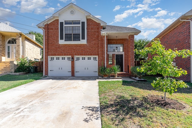 view of front property with a garage and a front lawn