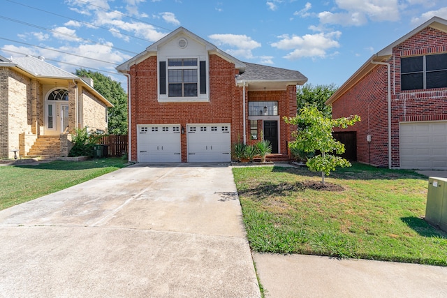 front facade with a front yard and a garage