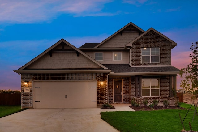 craftsman-style house with a lawn and a garage