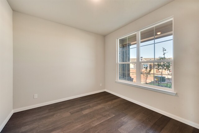 empty room featuring dark hardwood / wood-style floors