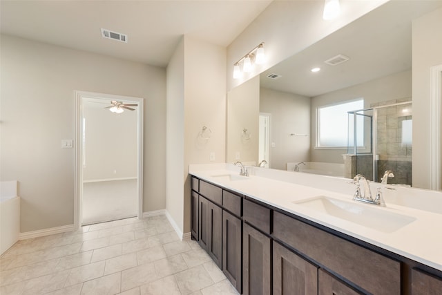 bathroom featuring tile patterned flooring, ceiling fan, shower with separate bathtub, and vanity