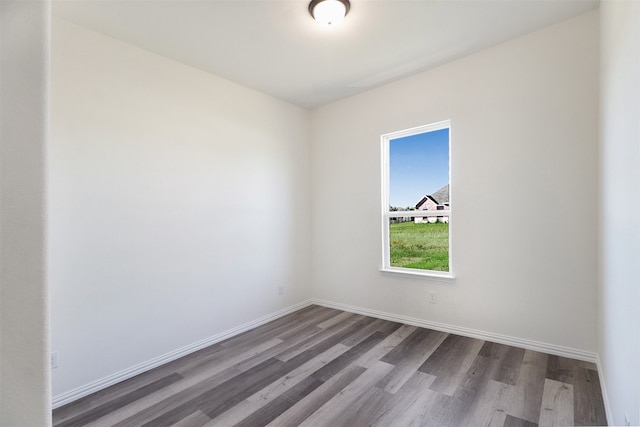 spare room featuring hardwood / wood-style floors