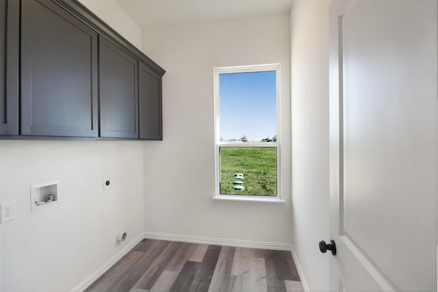 laundry area with washer hookup, dark wood-type flooring, cabinets, and hookup for an electric dryer