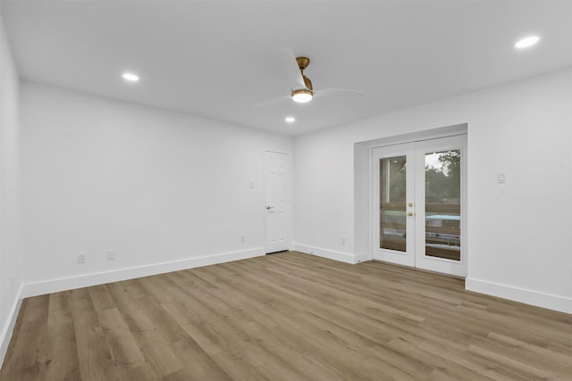 spare room featuring ceiling fan, french doors, and light hardwood / wood-style flooring