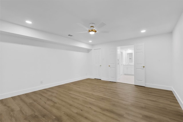 unfurnished room with hardwood / wood-style floors and ceiling fan