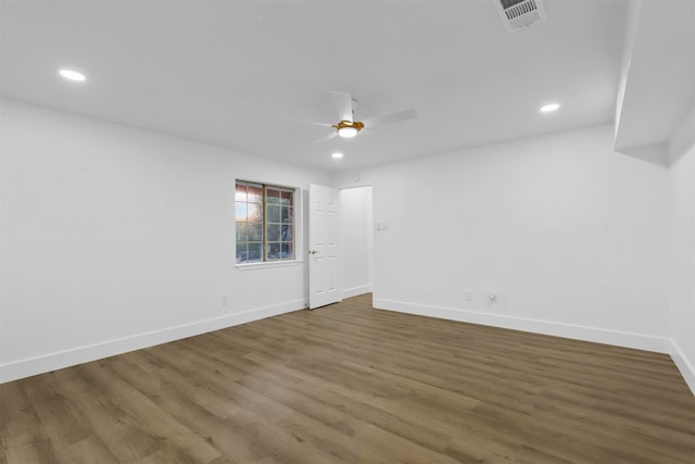 empty room with ceiling fan and wood-type flooring