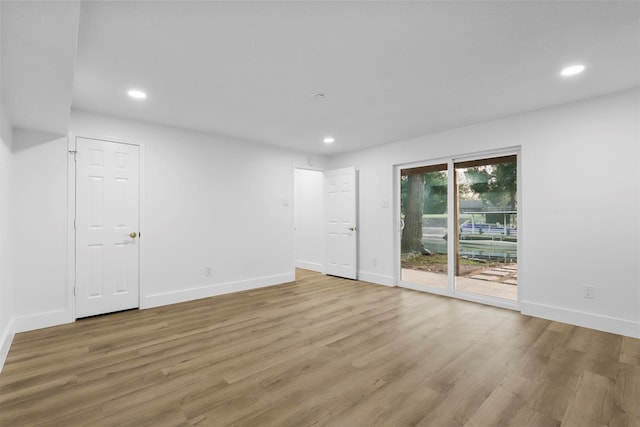 unfurnished room with light wood-type flooring