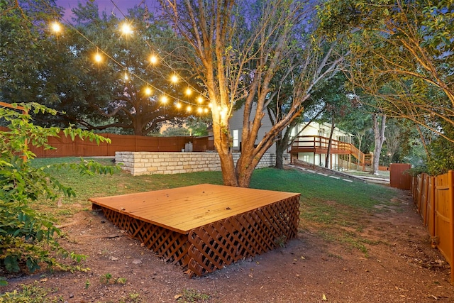 yard at dusk with a deck