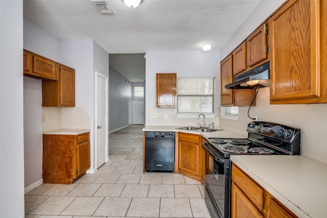 kitchen with black appliances, a textured ceiling, light tile patterned flooring, and sink