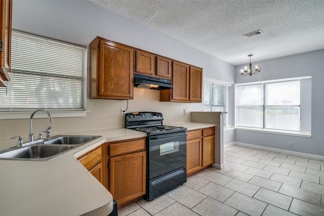 kitchen featuring hanging light fixtures, sink, a textured ceiling, a notable chandelier, and black range with electric cooktop