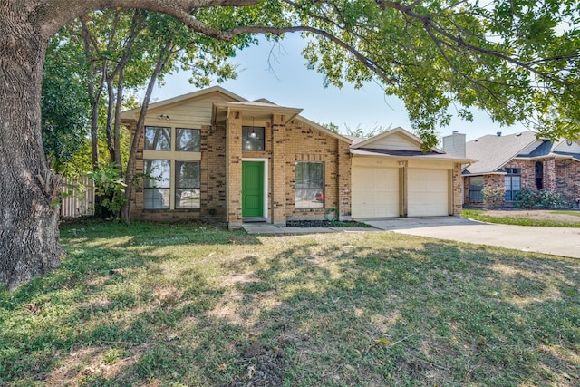 view of front facade with a garage and a front lawn