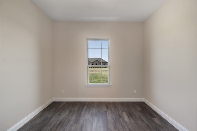 empty room featuring dark hardwood / wood-style flooring