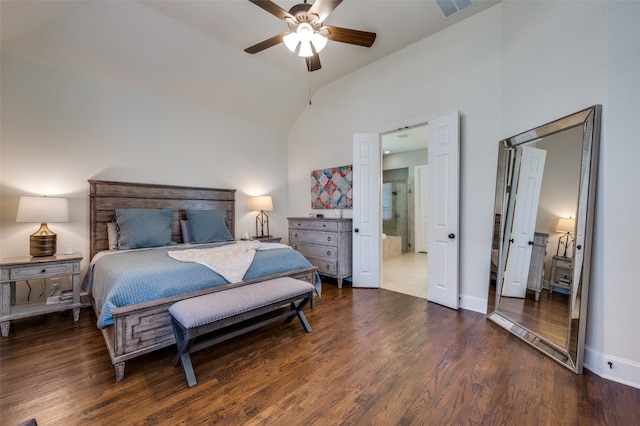 bedroom featuring dark hardwood / wood-style floors, high vaulted ceiling, ensuite bath, and ceiling fan