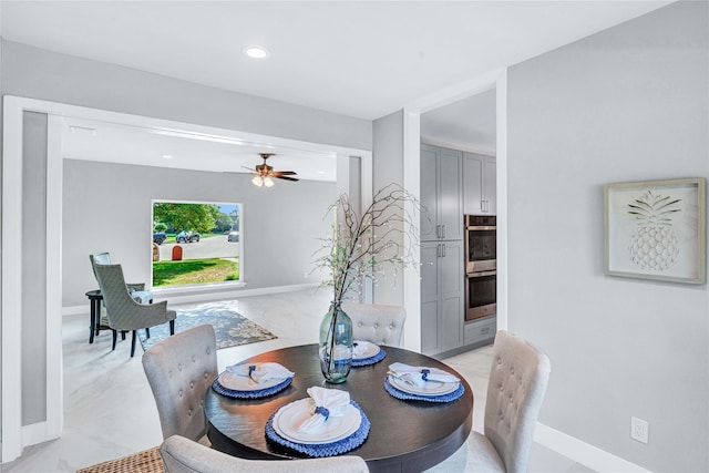 dining space with ceiling fan