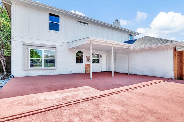 back of property with a patio area