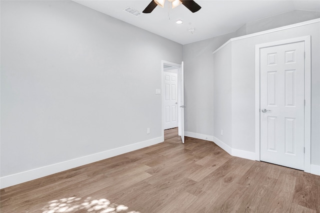 unfurnished bedroom with ceiling fan, light hardwood / wood-style flooring, and a closet