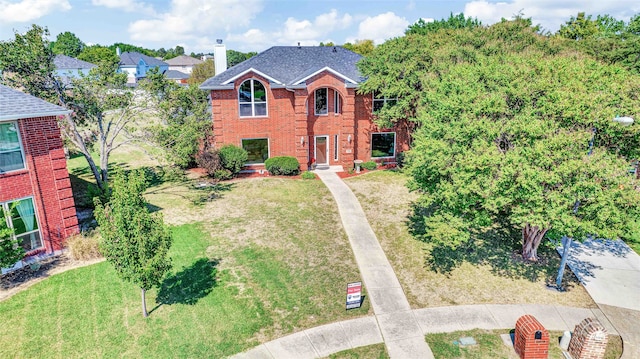 view of front of home with a front yard