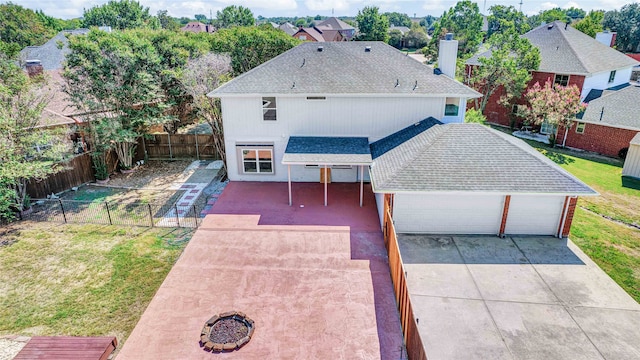 exterior space with a garage and a front lawn