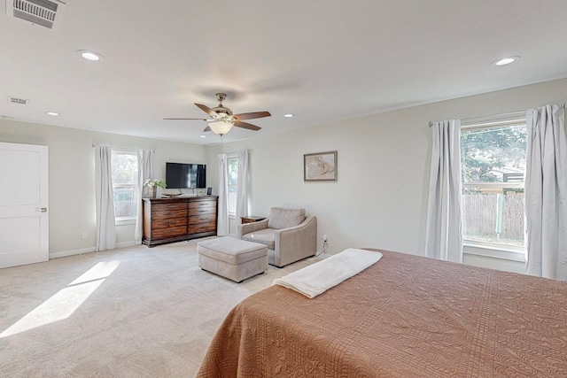 bedroom with ceiling fan and light colored carpet