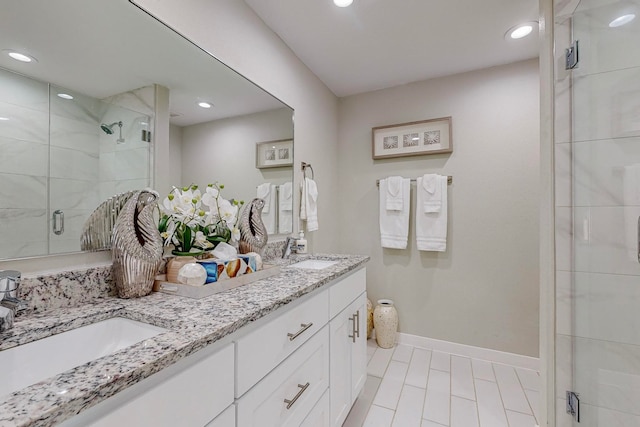 bathroom with vanity, tile patterned flooring, and a shower with door