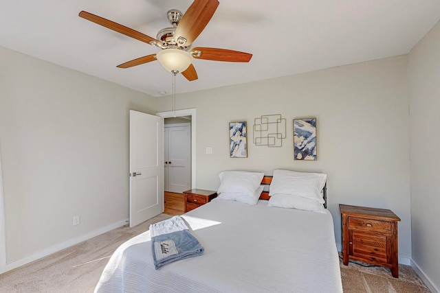 bedroom featuring ceiling fan and light colored carpet