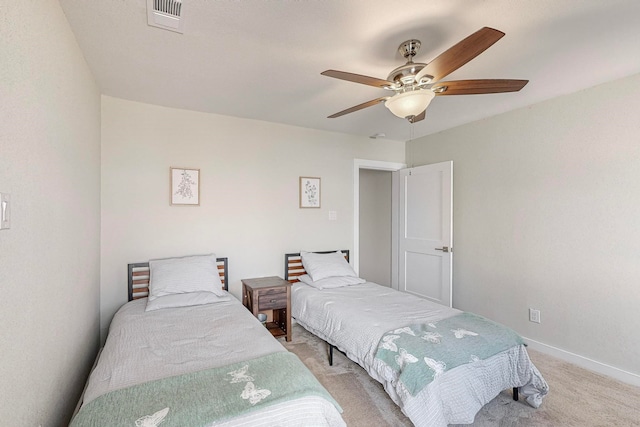 bedroom featuring ceiling fan and light colored carpet