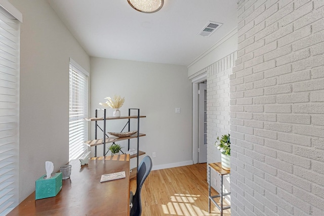 office with light hardwood / wood-style flooring